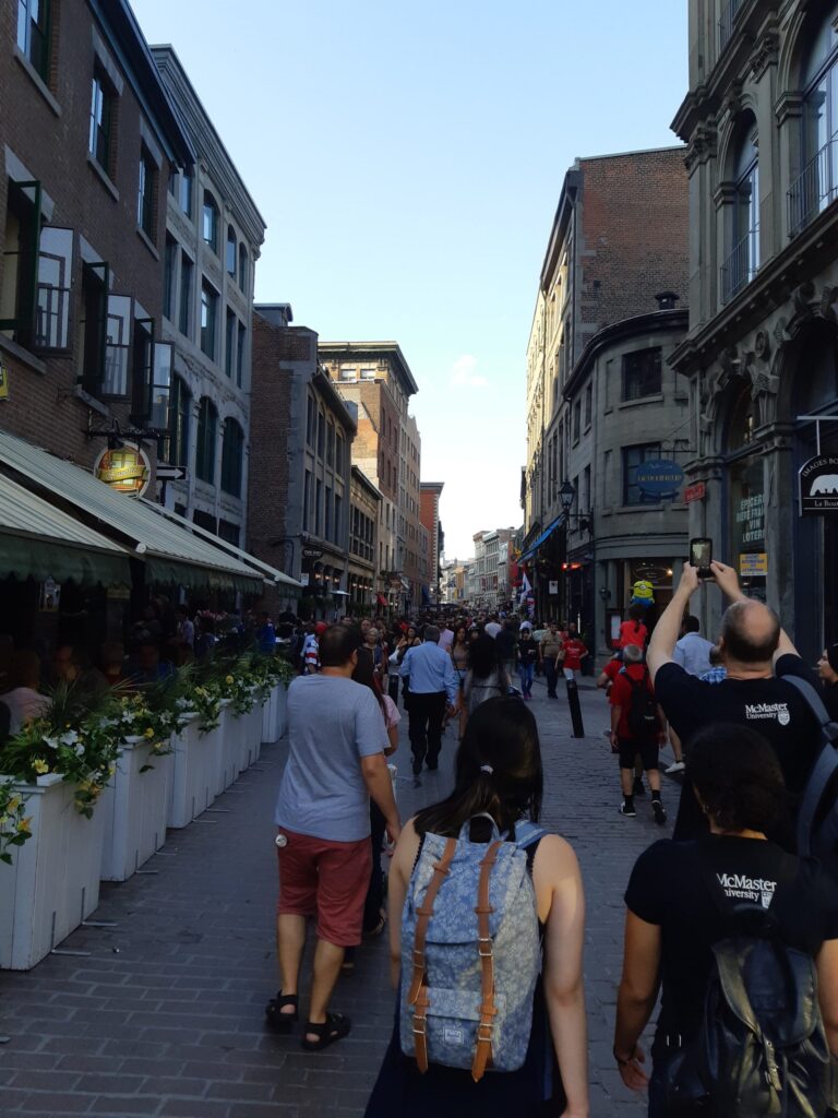 Students from the Digital Music Lab walking through a street in Montreal during ICMPC 2018.